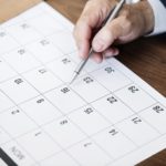 businessman-marking-on-calendar-for-an-appointment